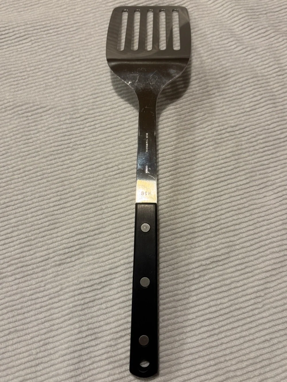 Martha Stewart Stainless Steel Slotted Spatula with Black Handle
